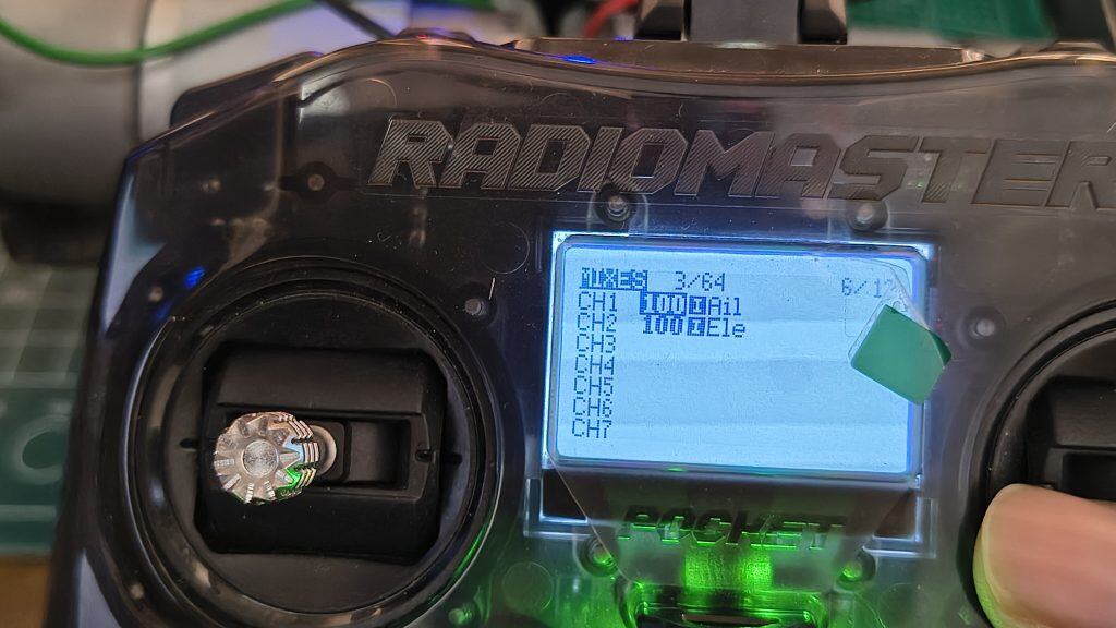 Close-up of the RadioMaster Pocket LCD screen showing the Mixer menu with Aileron (Ail) and Elevator (Ele) channel assignments configured for an RC robot or aircraft.