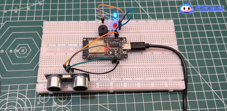 Completed ESP32 distance alarm prototype on a breadboard with a glowing blue LED and HC-SR04 ultrasonic sensor.